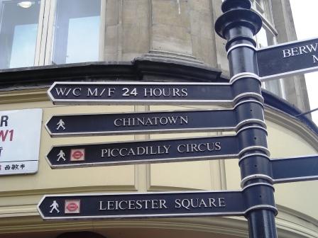 street sign in london directions to chinatown